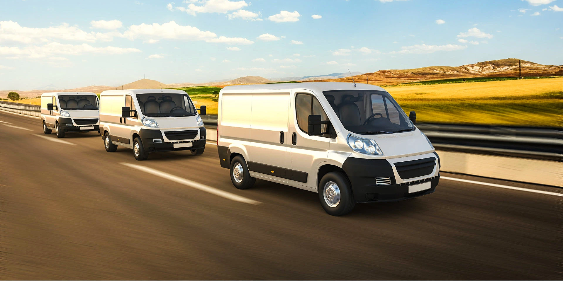 three vans running on a highway