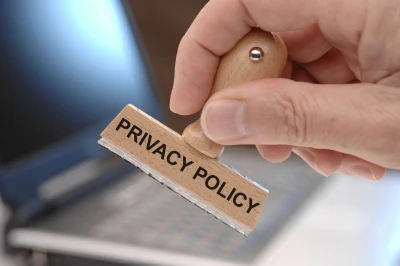 privacy policy marked on rubber stamp in hand