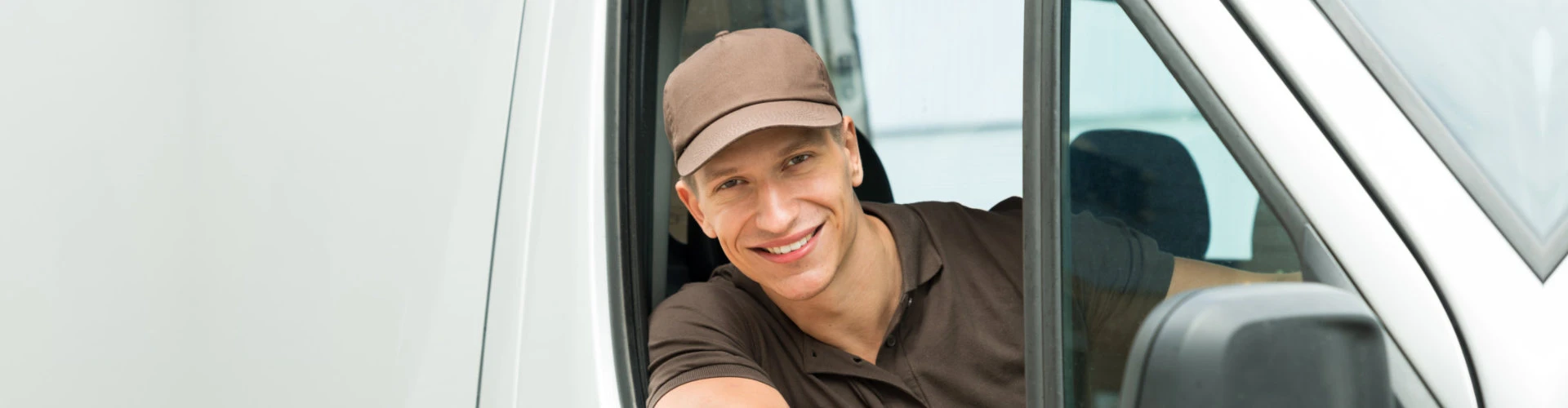 van driver peeking outside the window